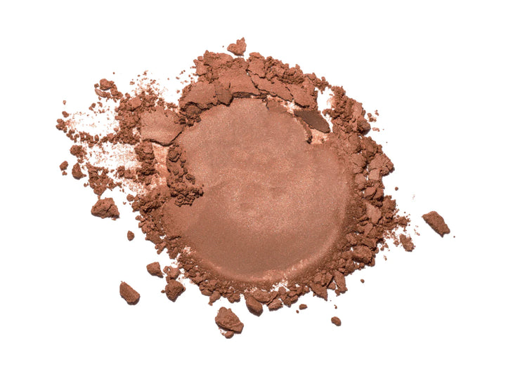 Brown makeup powder on a white background