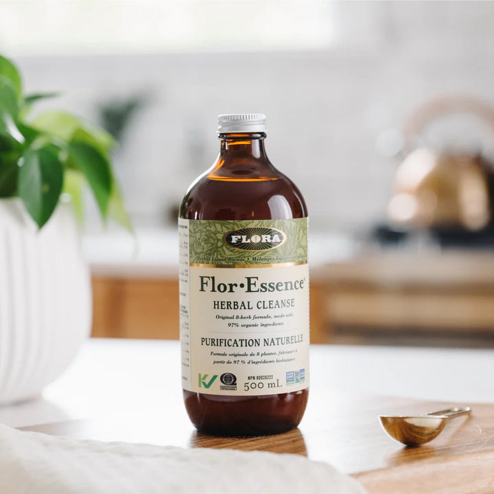 Bottle of Flor Essence Herbal Cleanse on a table with a blurred background