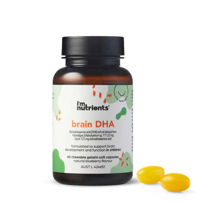 Supplement bottle labeled 'i'm nutrients brain DHA' with two yellow capsules on a white background