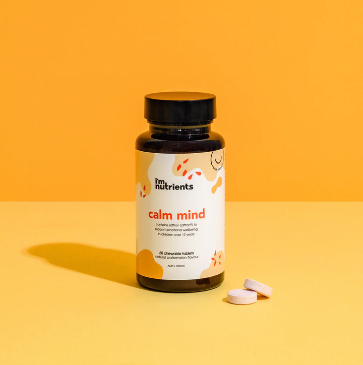 Bottle of 'calm mind' supplements from 'fn nutrients' on an orange background