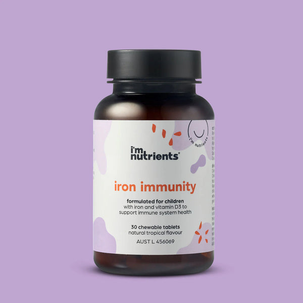 Bottle of im nutrients iron immunity supplement on a purple background