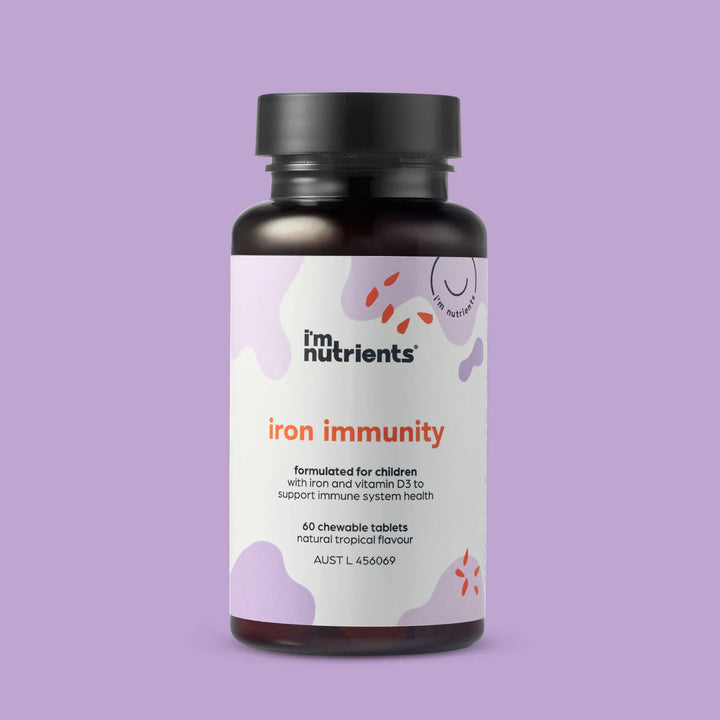 Bottle of 'iron immunity' supplement for children on a purple background