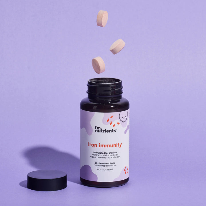 Fm Nutrients iron immunity supplement bottle with tablets on a purple background