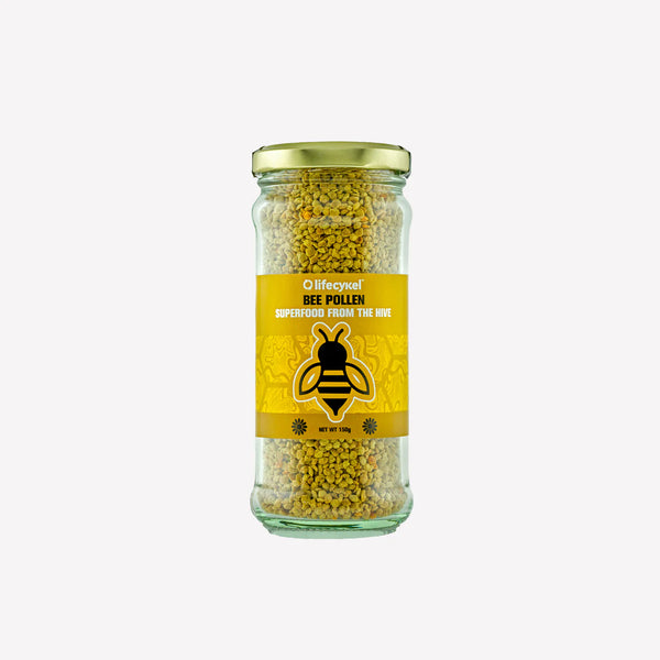 Jar of bee pollen with a yellow label on a white background