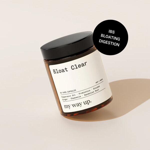 Jar labeled 'Bloat Clear' with a black lid on a beige background
