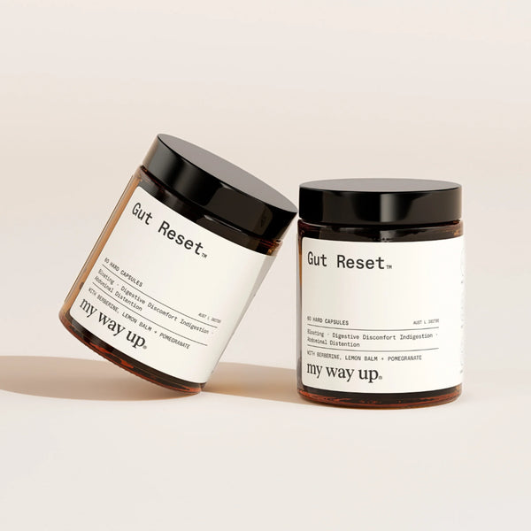 Two jars labeled 'Gut Reset' by 'my way up' on a beige background
