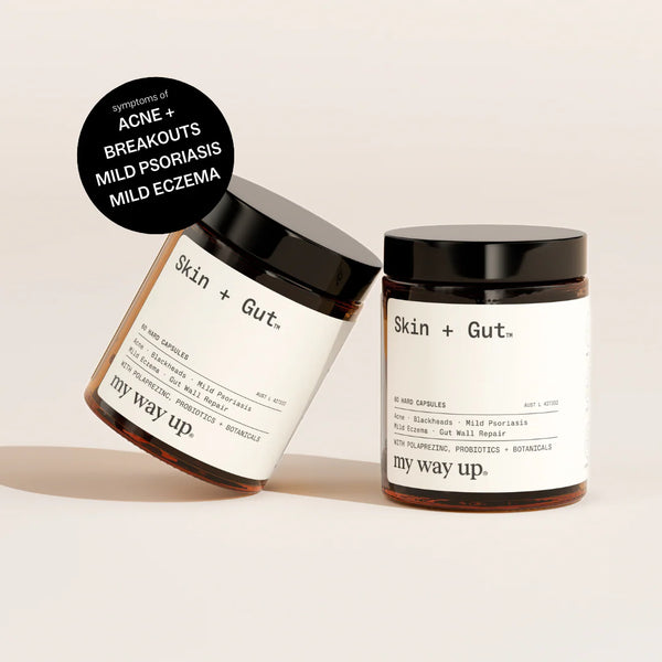 Two jars of 'Skin + Gut' products on a beige background