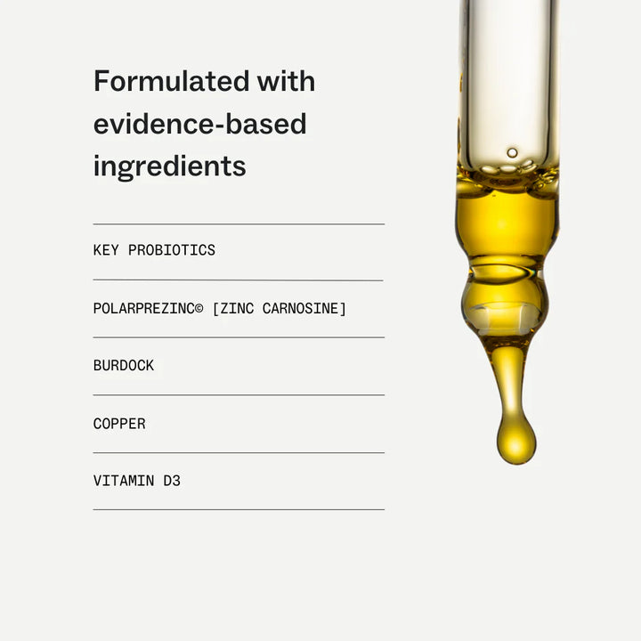 A dropper with yellow liquid and a list of ingredients on a white background
