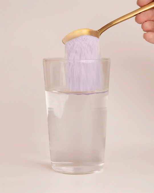 Nutra Organics Collagen Beauty with Verisol & Vitamin C Blueberry Wildflower stirring in water