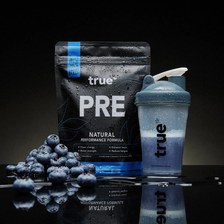 true PRE supplement package with shaker bottle on a reflective surface