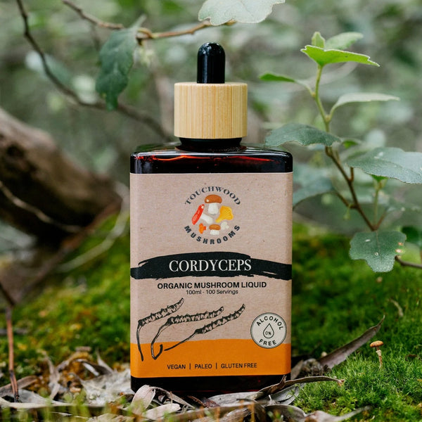Bottle of Cordyceps organic mushroom liquid with a natural background